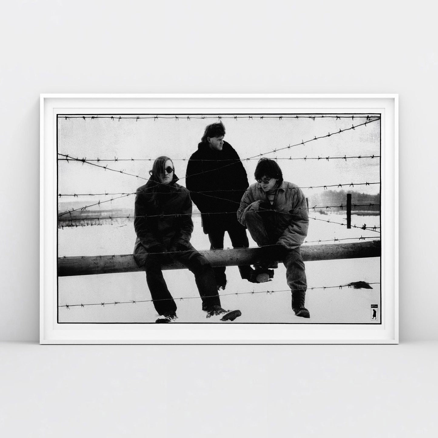 Large poster of Egor Letov and Grazhdanskaya Oborona band sitting in a snowy field behind barbed wire. www.egorletov.com