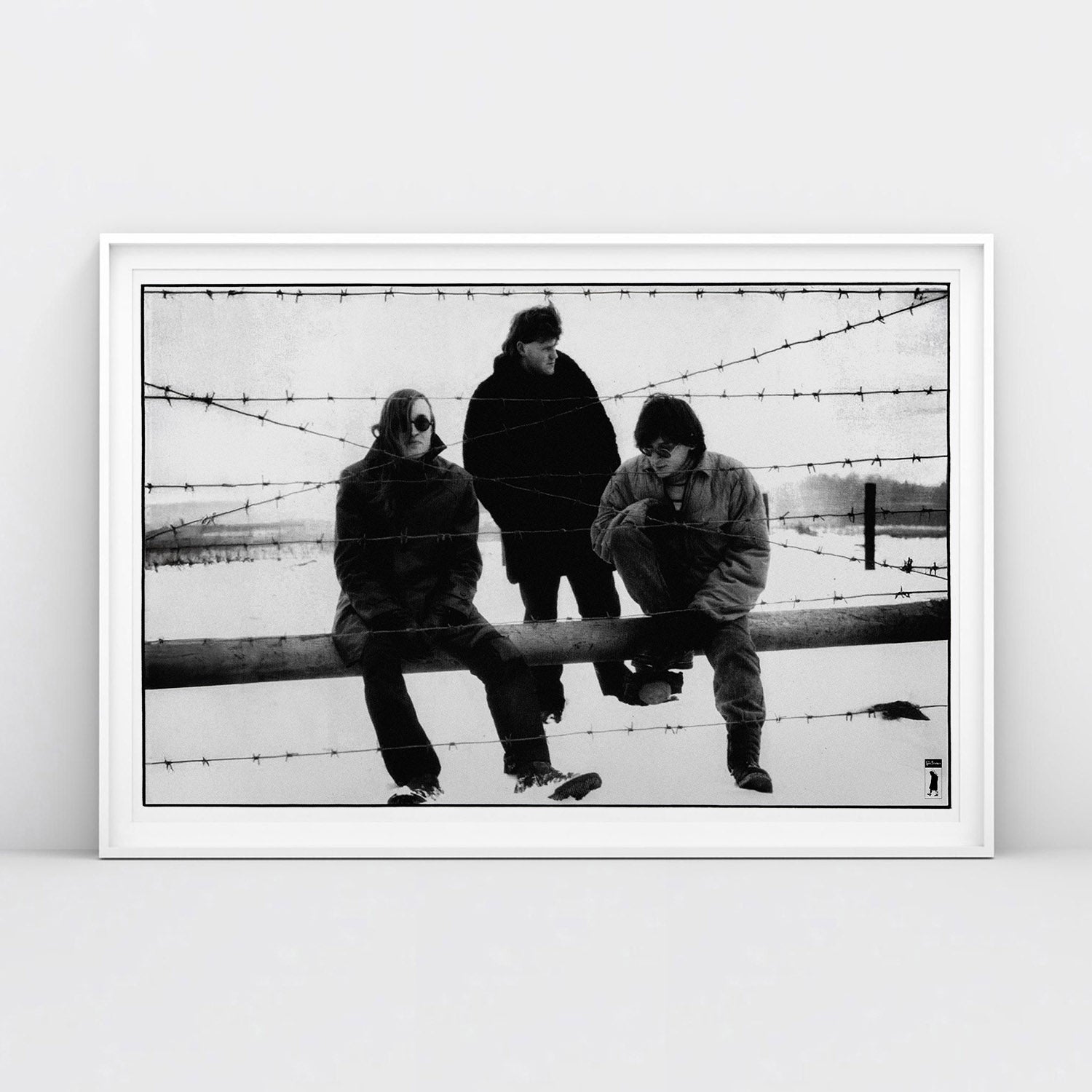 Large poster of Egor Letov and Grazhdanskaya Oborona band sitting in a snowy field behind barbed wire. www.egorletov.com