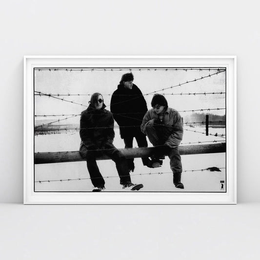 Large poster of Egor Letov and Grazhdanskaya Oborona band sitting in a snowy field behind barbed wire. www.egorletov.com